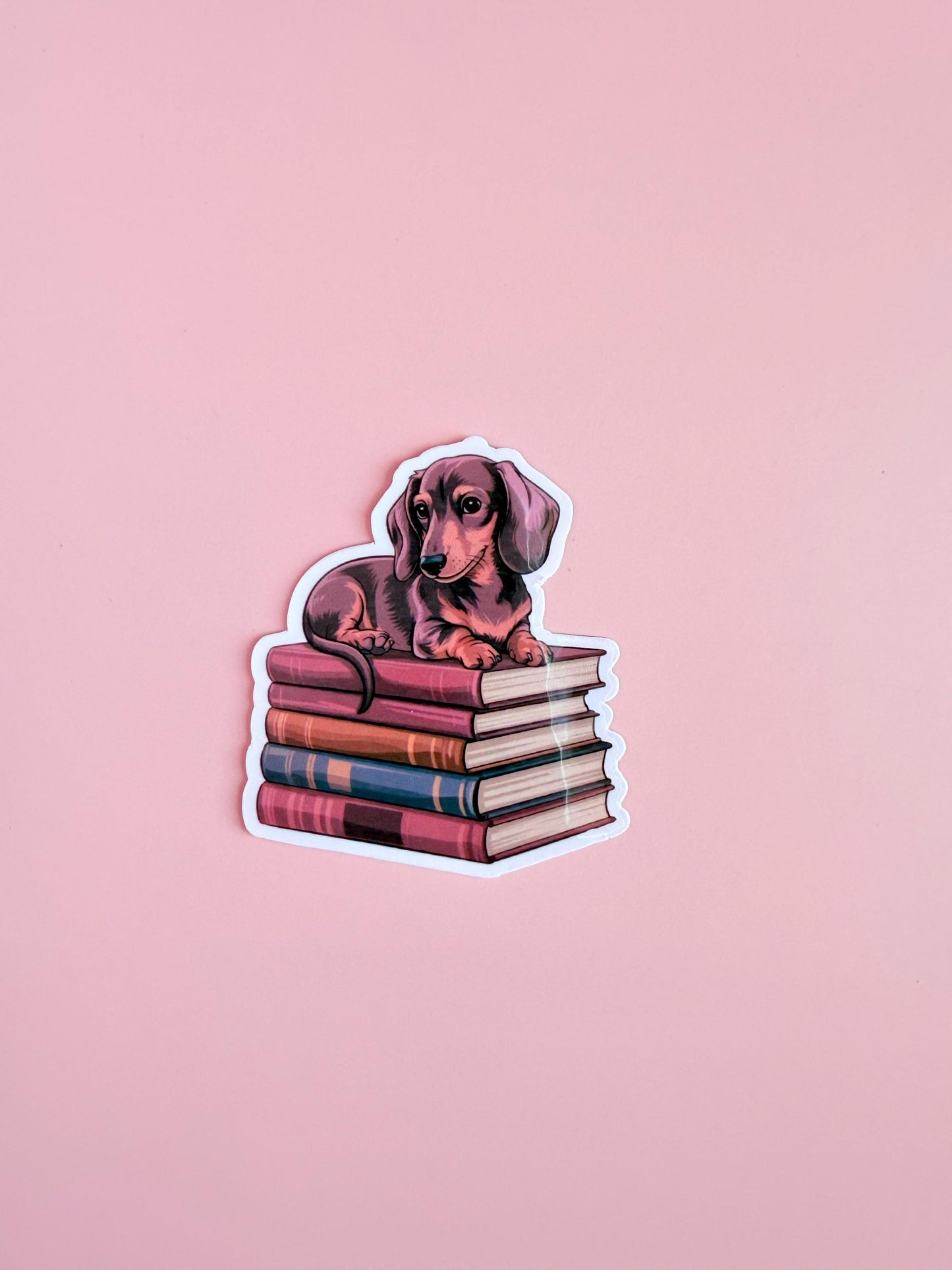 Dachshund on Books Sticker – Cute Dog & Bookish Vinyl for Planners, Dog Lover Gifts| kindle-Bookish Stickers-Reading Sticker-ereader - The Sticker Era