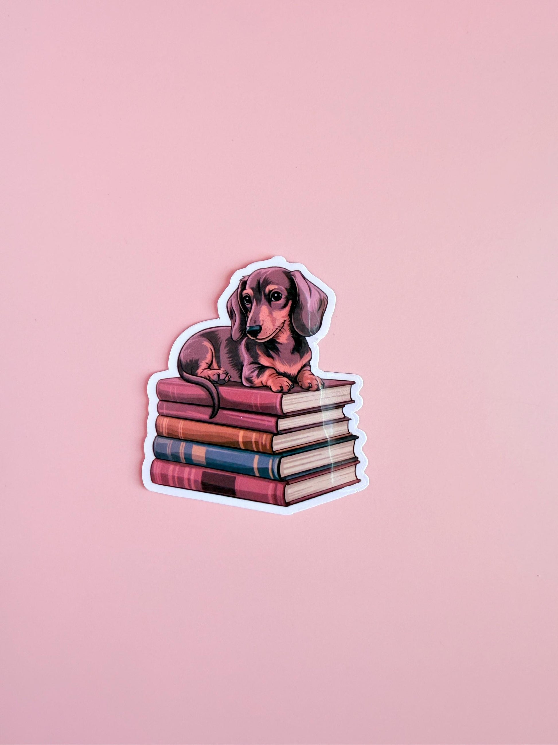 Dachshund on Books Sticker – Cute Dog & Bookish Vinyl for Planners, Dog Lover Gifts| kindle-Bookish Stickers-Reading Sticker-ereader - The Sticker Era