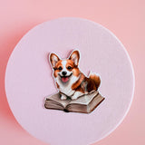 Corgi on a Book Sticker | Cute Bookish Dog Vinyl Decal by The Sticker Era