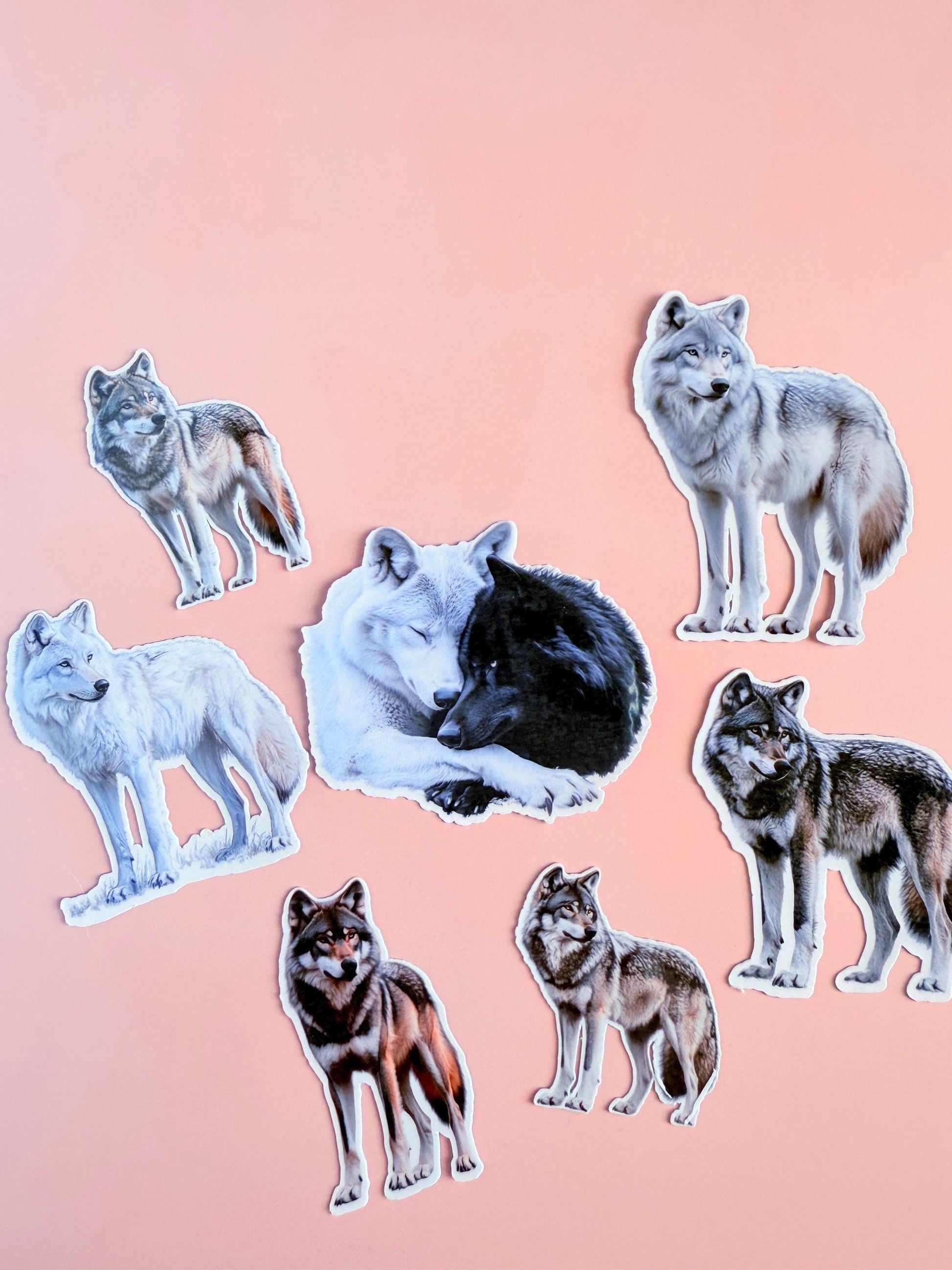 Aesthetic wolf vinyl sticker bundle featuring 8 realistic wolves, including black, white, and brown wolf art on a peach background.