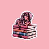 Dachshund on Books Sticker | Cute Bookish Dog Vinyl Decal by The Sticker Era