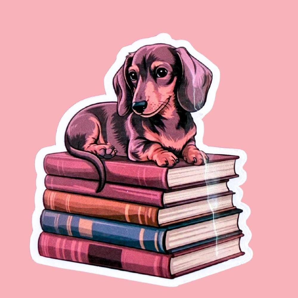 Dachshund on Books Sticker | Cute Bookish Dog Vinyl Decal by The Sticker Era