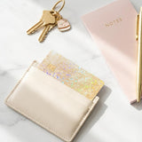 Gold glitter debit card skin styled with keys and neutral decor by The Sticker Era
