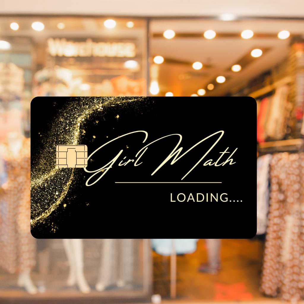 Debit card sticker that says Girl math...loading on a window in front of a clothing store. 
