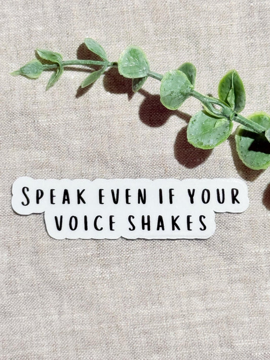 Speak Even If Your Voice Shakes" empowerment sticker on linen with eucalyptus