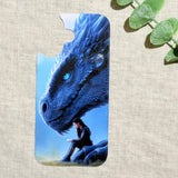 Blue dragon phone insert with a luminous dragon over a reading girl on a clear iPhone case styled with eucalyptus by The Sticker Era