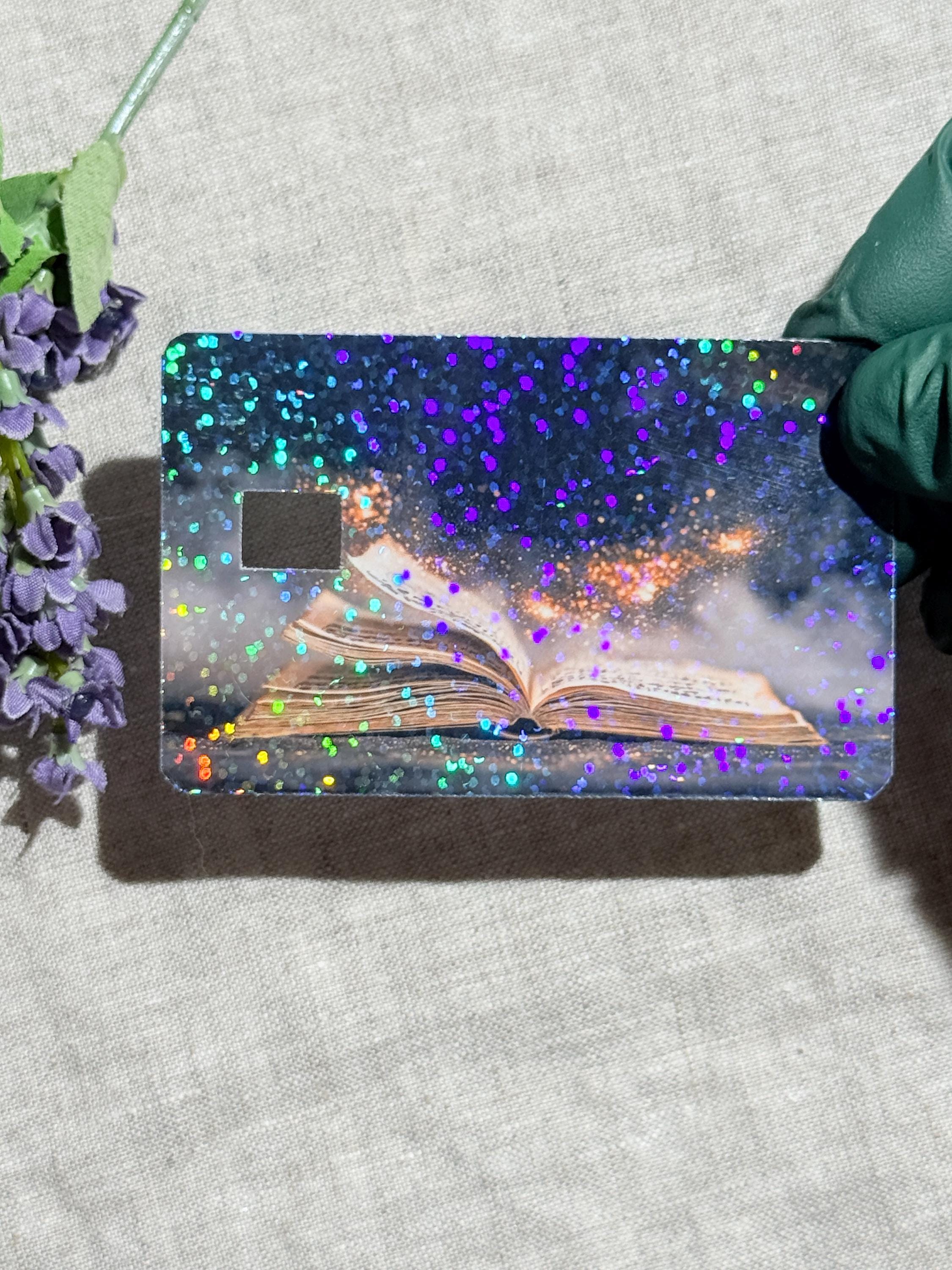 Celestial magic book debit card skin styled flat lay by The Sticker Era
