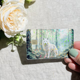White wolf credit card sticker held up in sunlight by The Sticker Era