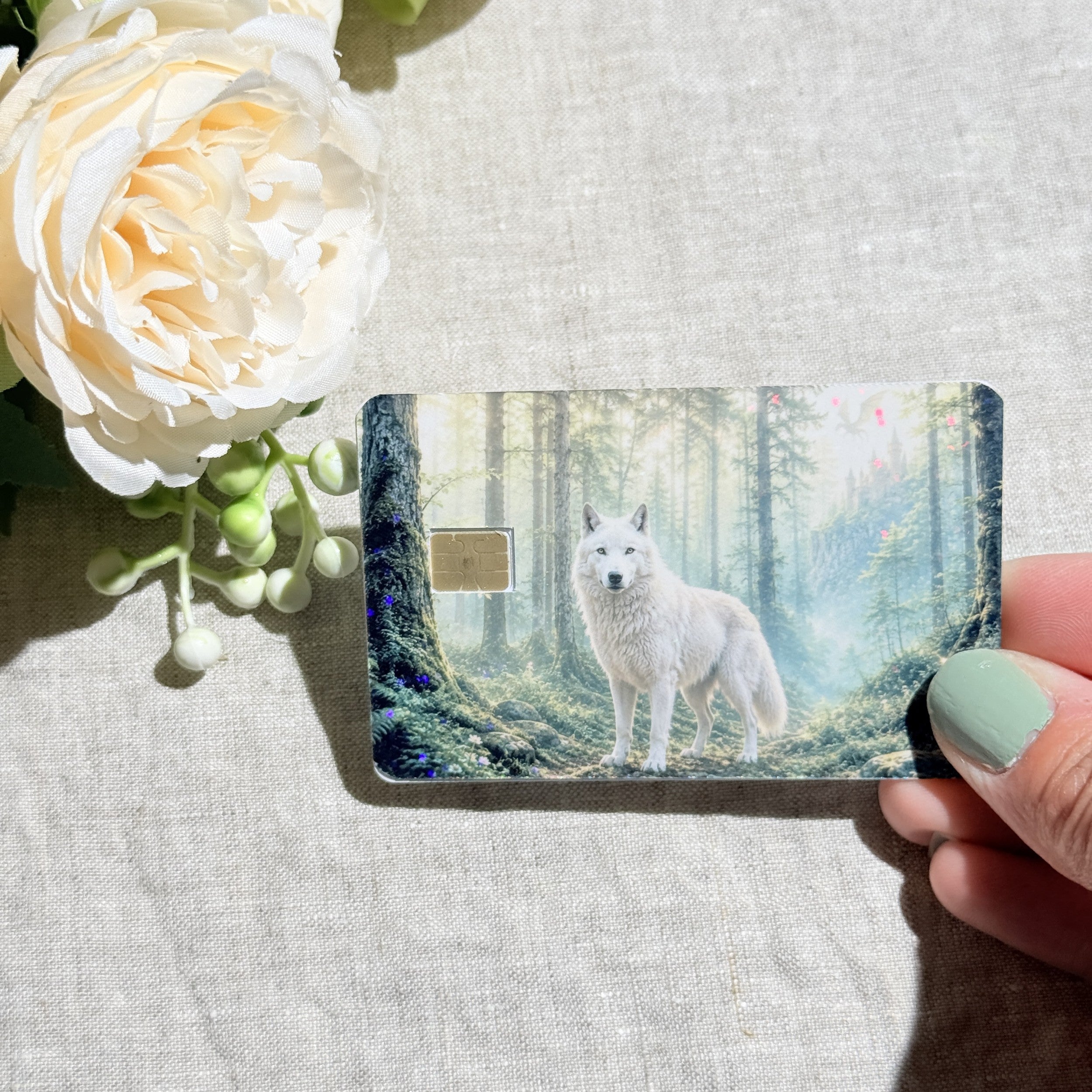 Misty forest wolf card skin held at an angle by The Sticker Era