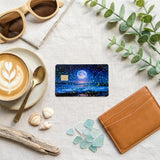 Moon ocean holographic card skin in hand by The Sticker Era