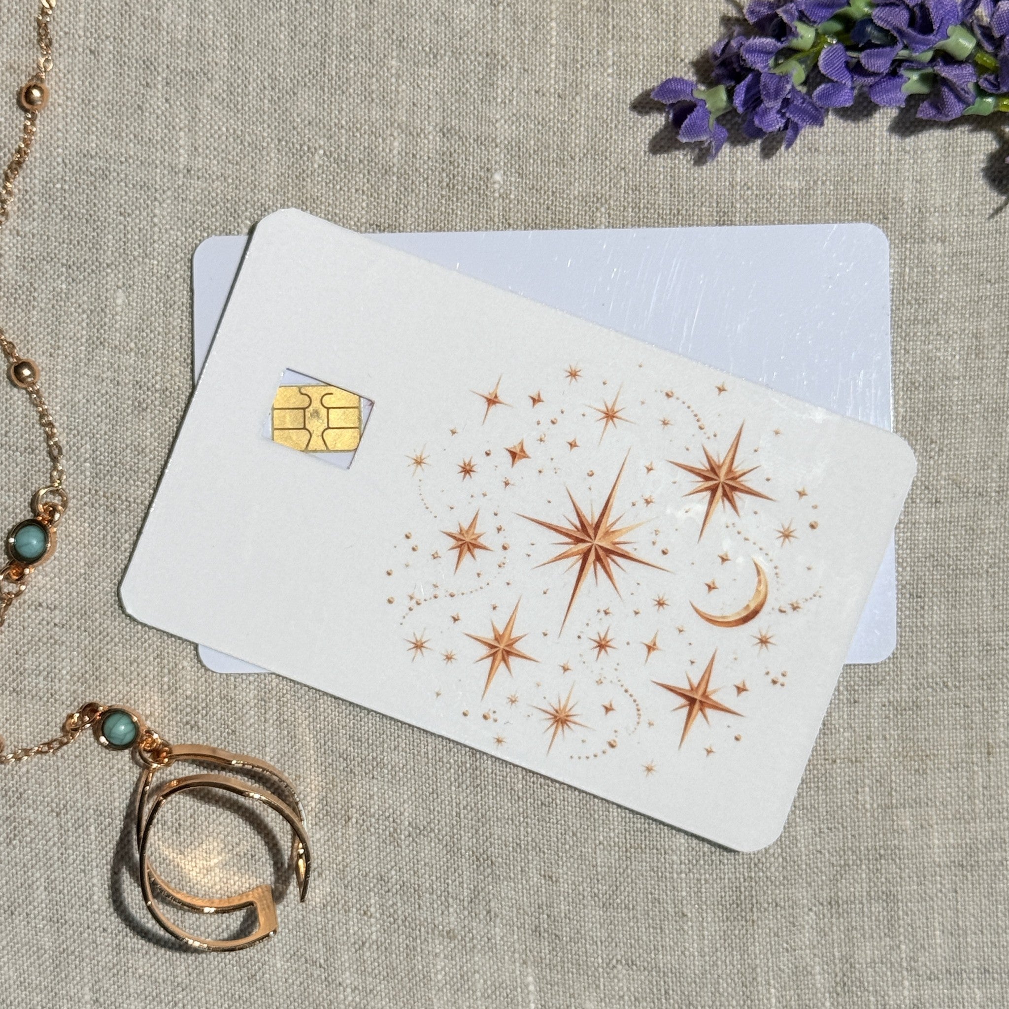 Copper constellation debit card sticker shown flat on linen