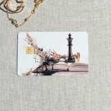 Dark academia chess debit card sticker shown flat on linen