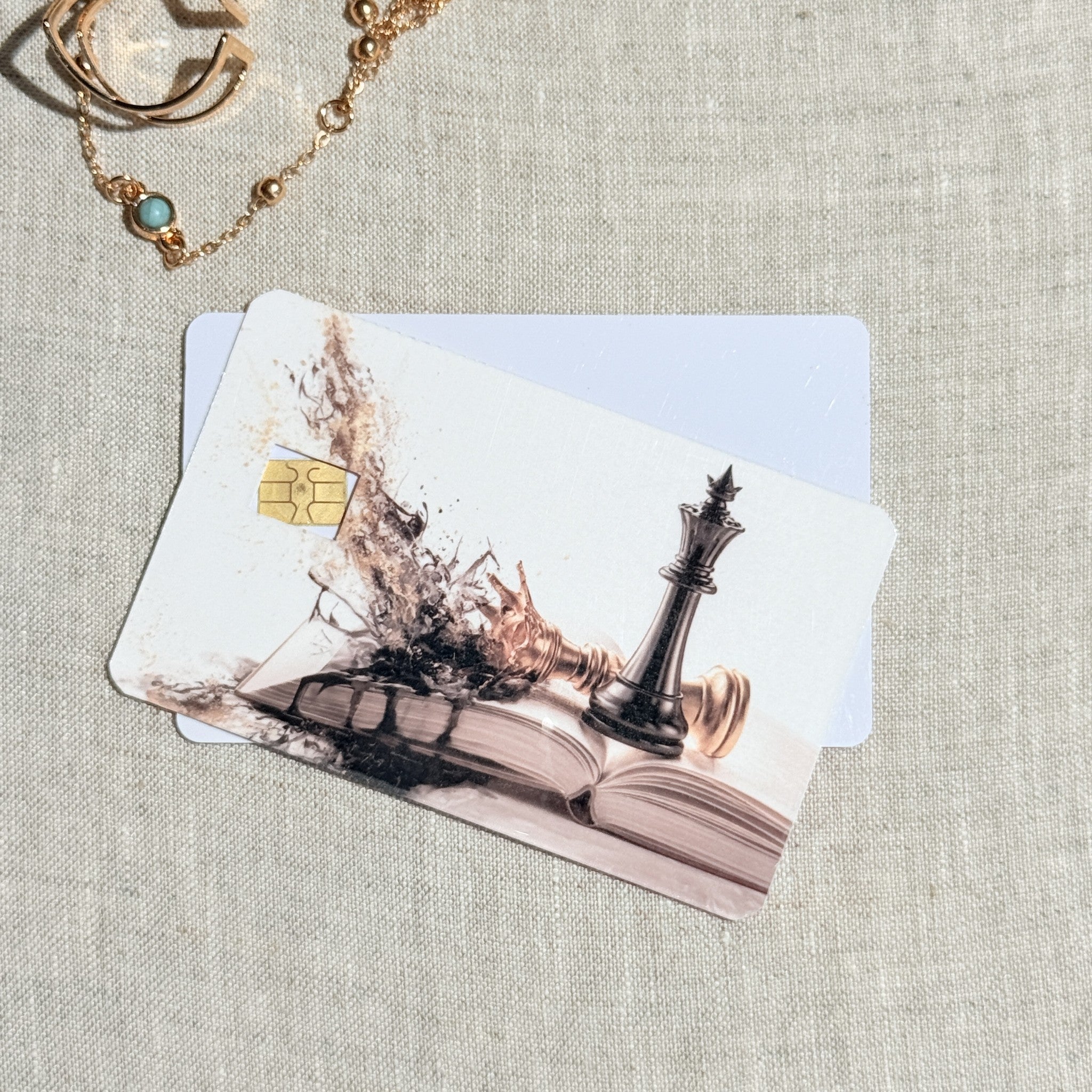 Two chess king card skins stacked to show the standard and sparkle finishes