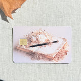 Blush writer debit card sticker shown flat on linen