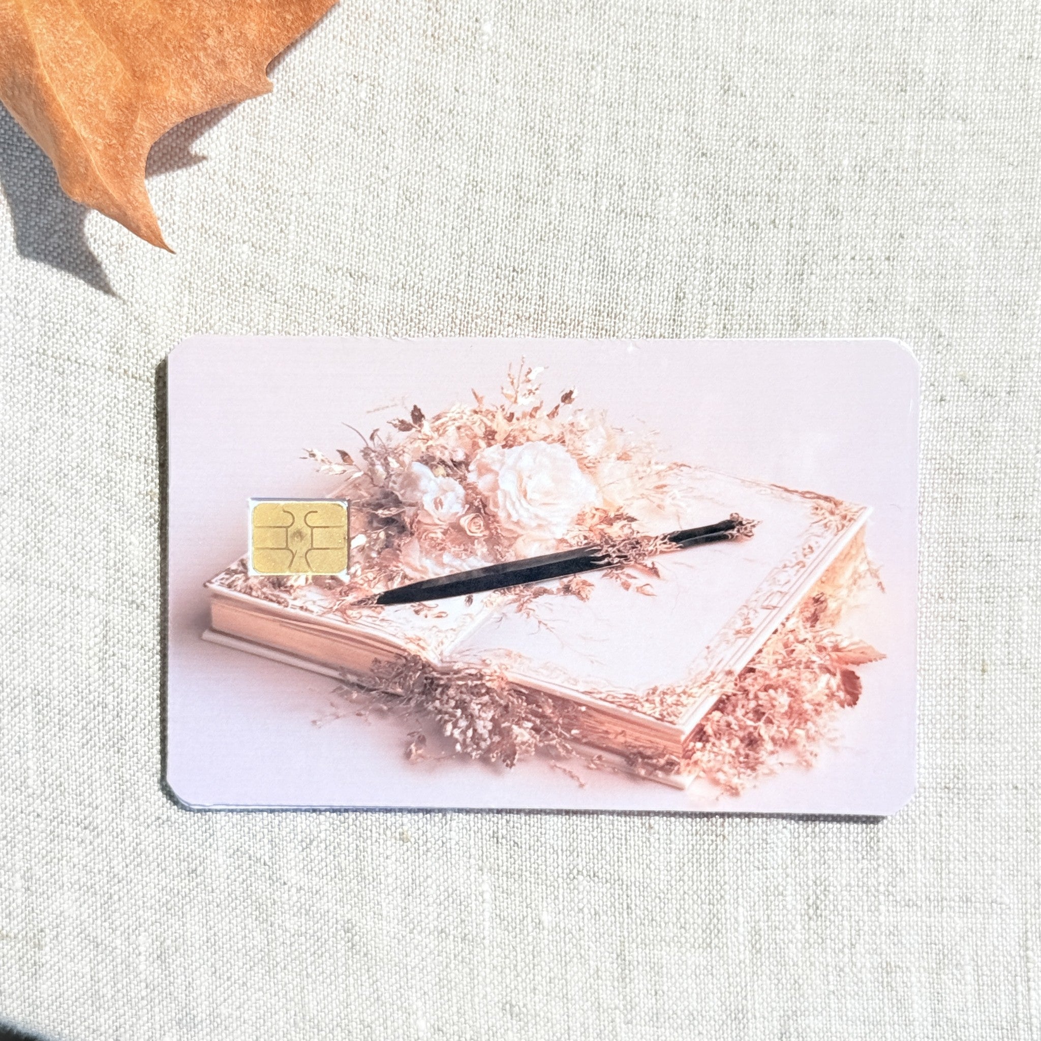 Quill and roses card skin showing the soft pink background