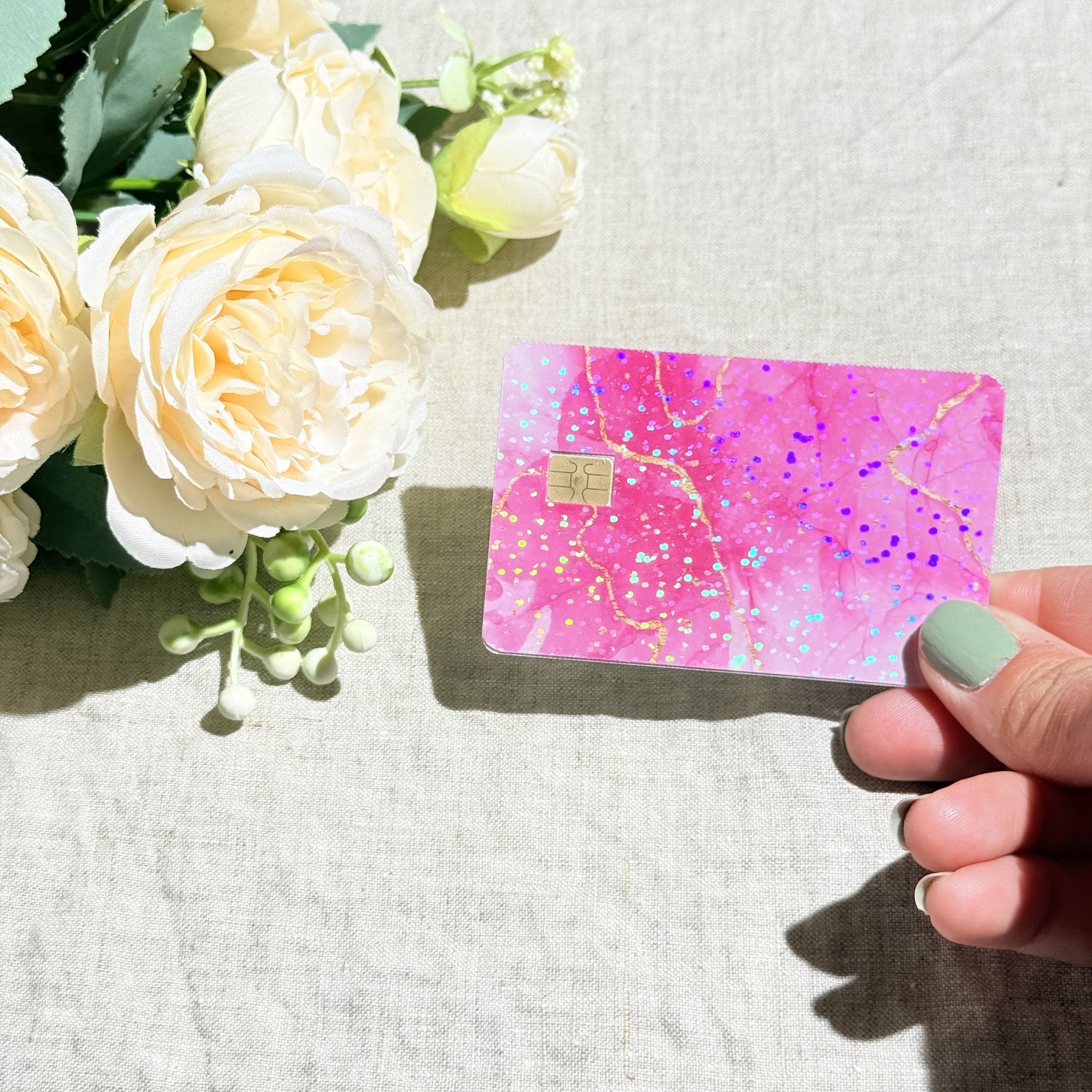 Close-up of gold veins running through hot pink marble on the card skin by The Sticker Era