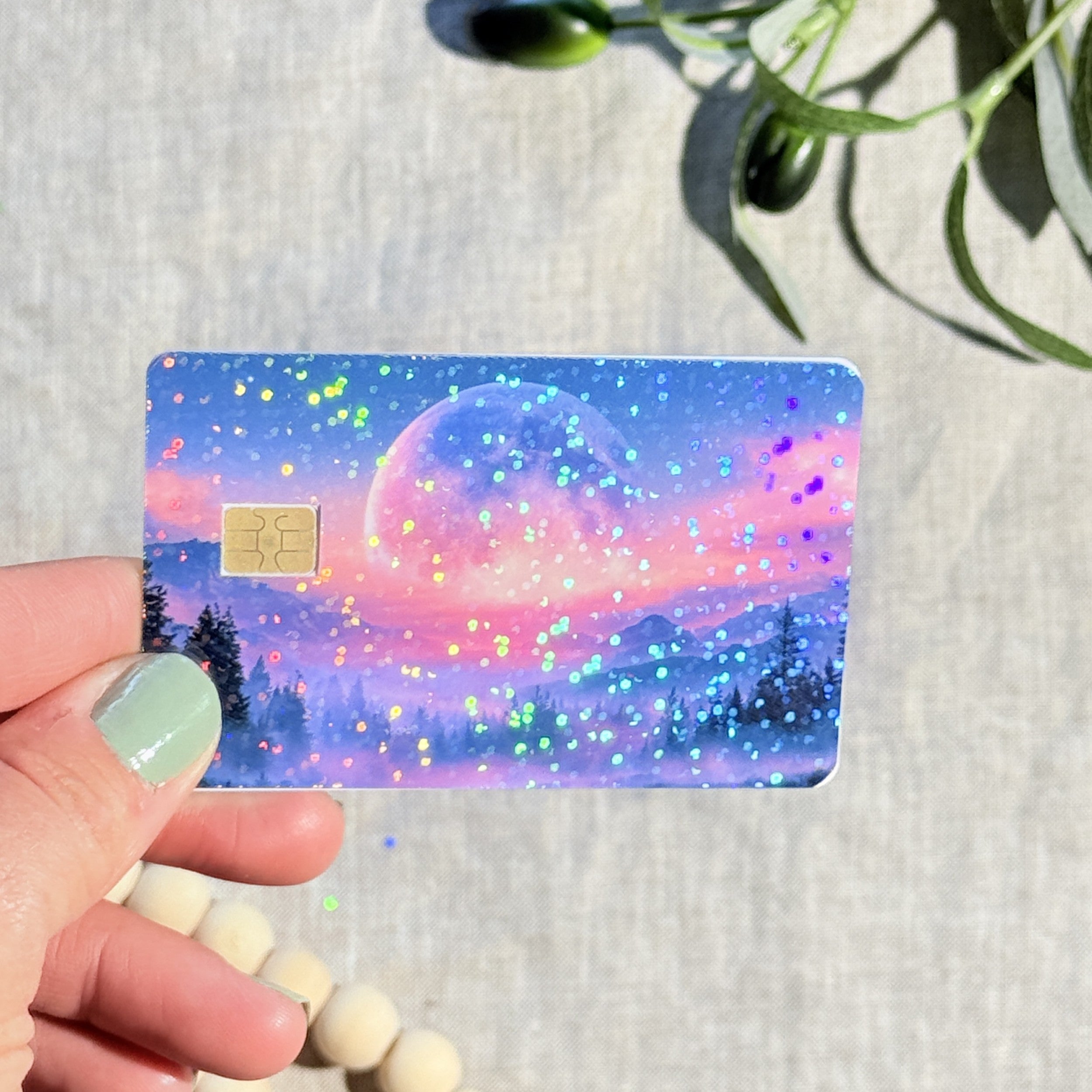 Close-up of rainbow sparkle on the pink sky moon card skin by The Sticker Era