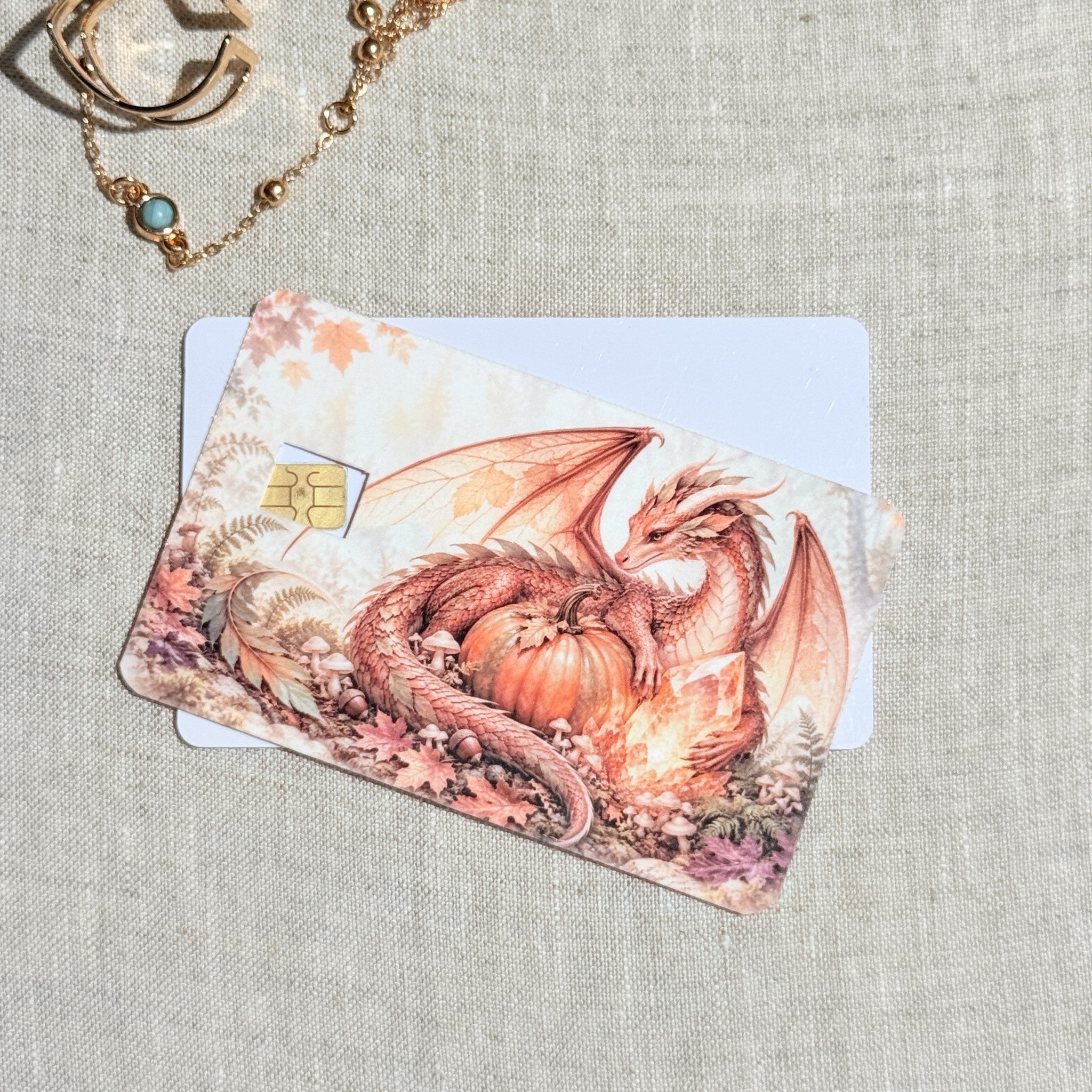 Two pumpkin dragon card skins stacked to show the standard and sparkle finishes