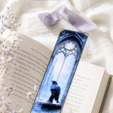 Raven bookmark tucked into an open book by The Sticker Era