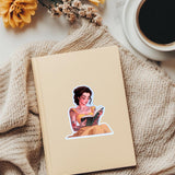 Tattooed princess reading sticker styled flat lay by The Sticker Era