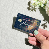 Hand holding the Therapy debit card skin in sunlight by The Sticker Era
