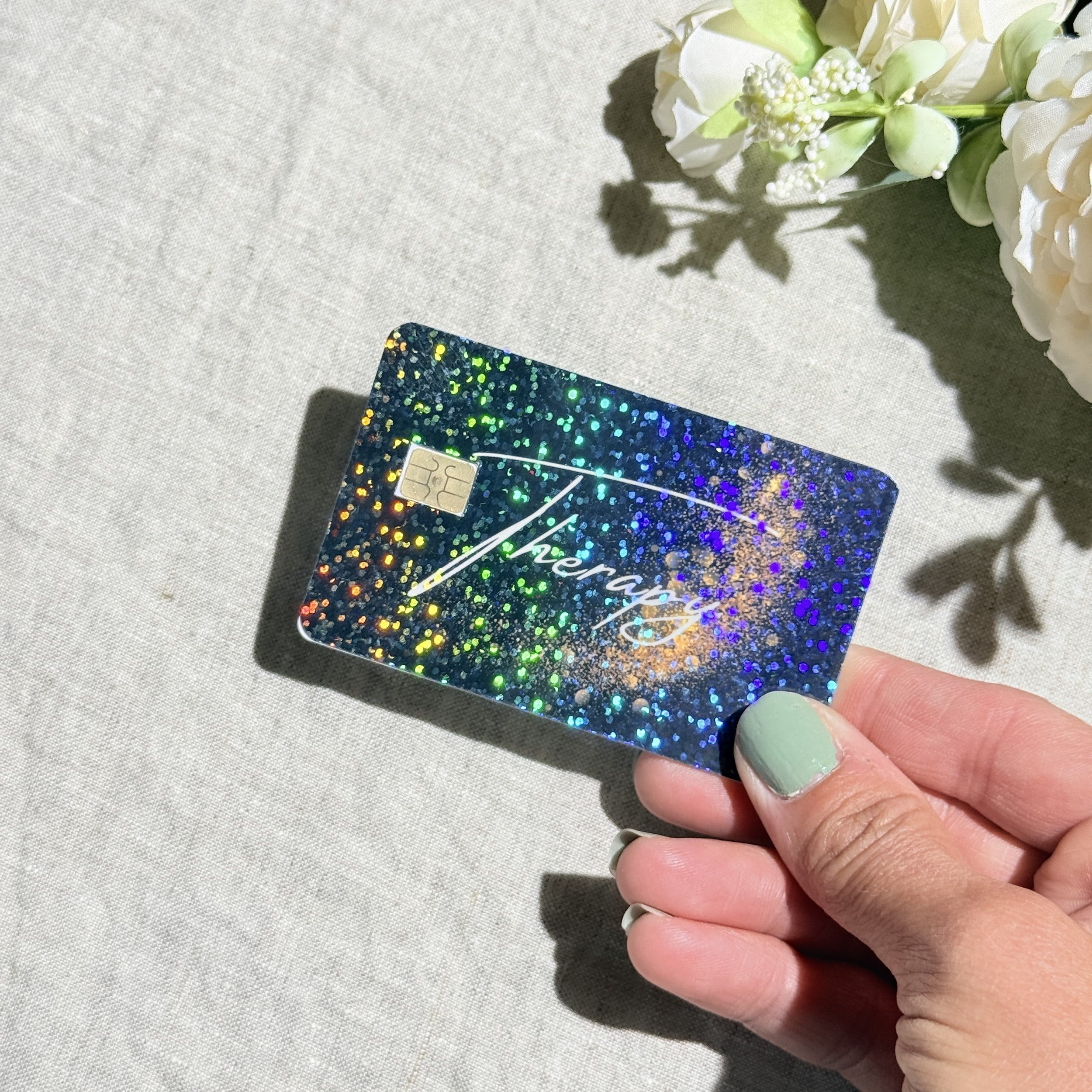 Therapy card skin held at an angle catching the light by The Sticker Era