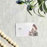 Hand holding the girl reading with wolf card skin in sunlight by The Sticker Era