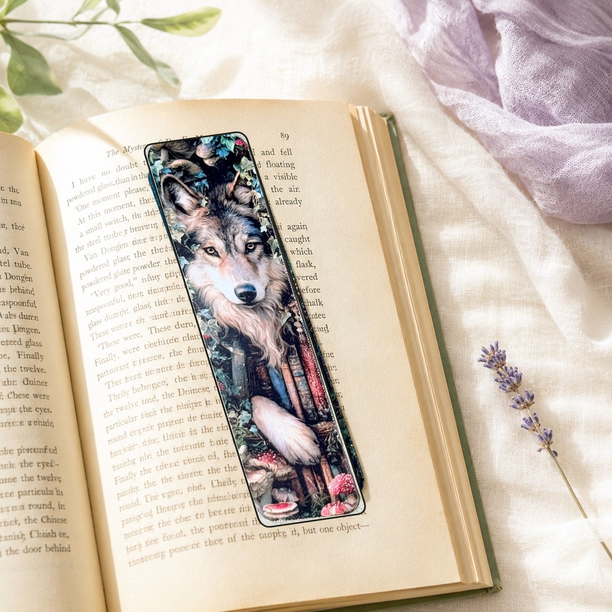 Wolf bookmark resting on an open book by The Sticker Era