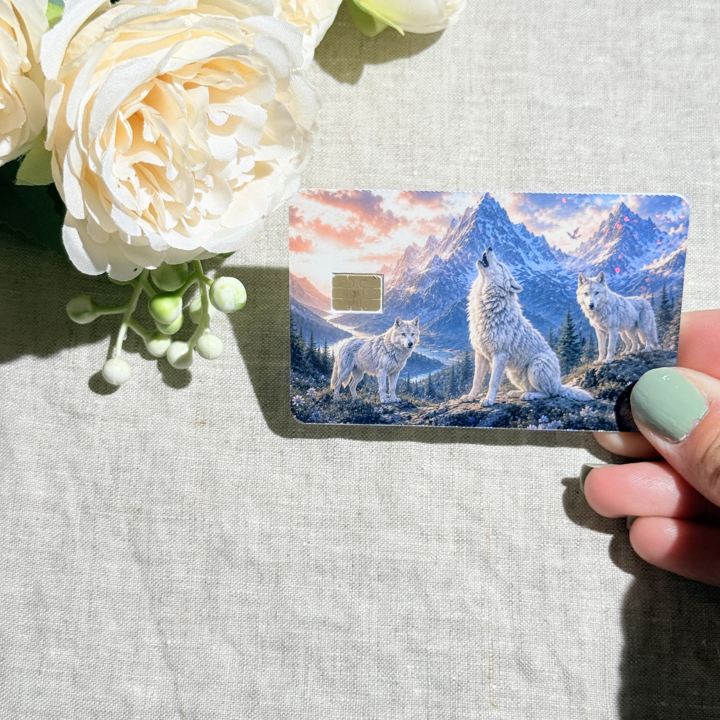 Wolf pack credit card sticker held at an angle by The Sticker Era